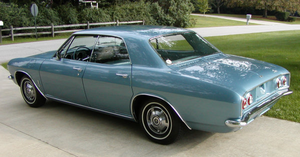 1965 Corvair Monza sport sedan (rear 3/4 view)